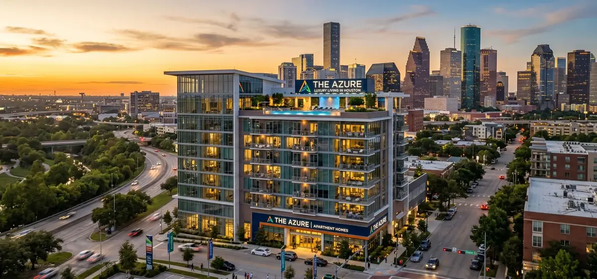 Houston Second Chance Apartments - downtown Houston skyline with apartment buildings at sunset